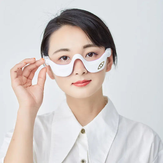 Hot Compress Eye Massager With Vibration Therapy worn during a relaxation session